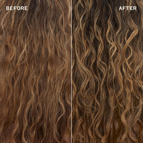 Spraying Amika on dry hair to tame flyaways and reduce frizz