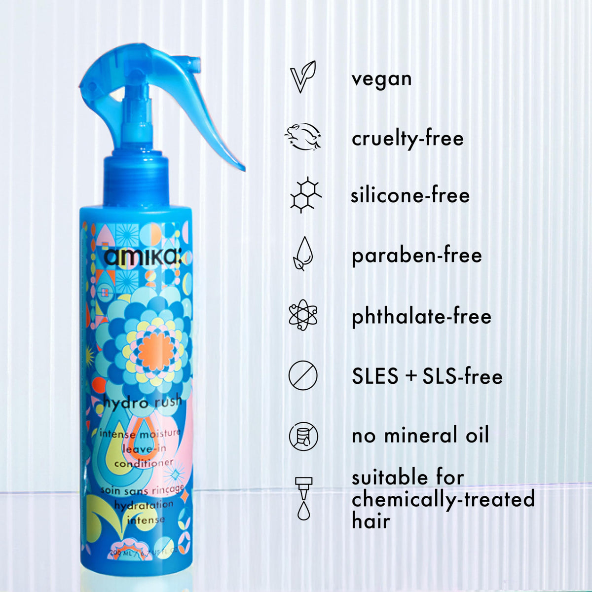 Amika next to ruler showing 60ml compact travel-friendly size