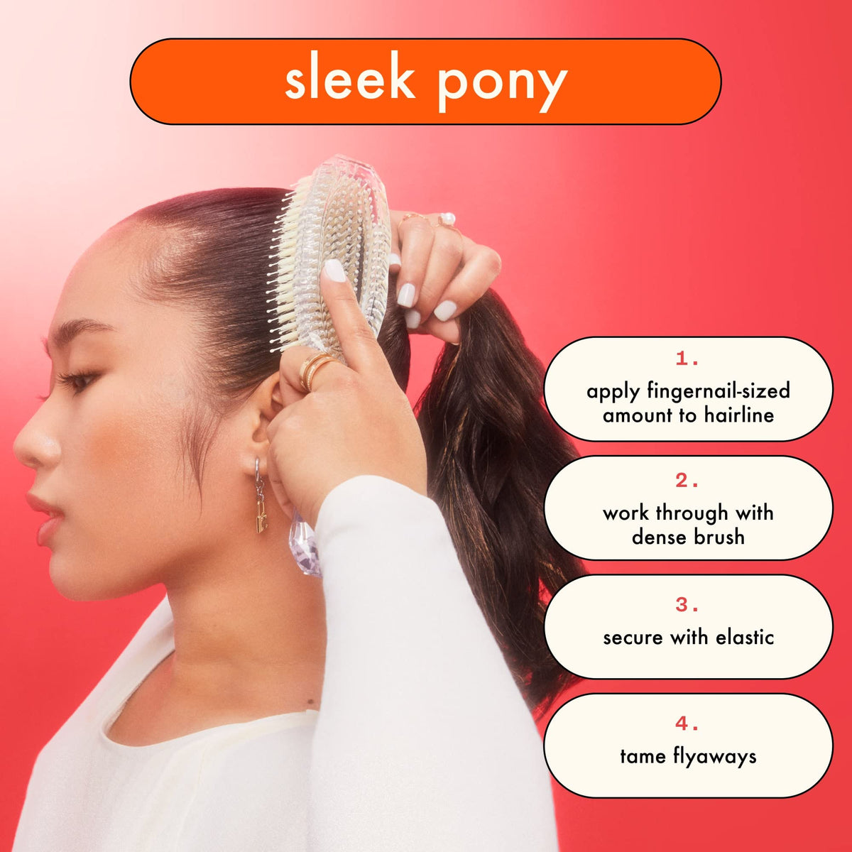 amika on lock smoothing a sleek ponytail showing long-lasting hold