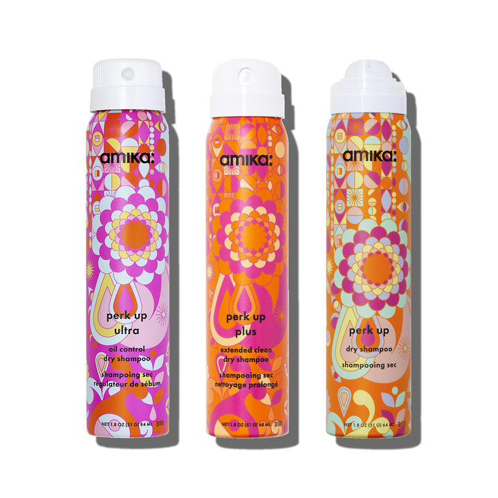 amika front packaging trio of travel dry shampoos for on-the-go refresh