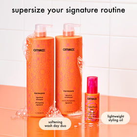 Amika Superfruit Star full-size styling oil bottle displayed for lightweight protection