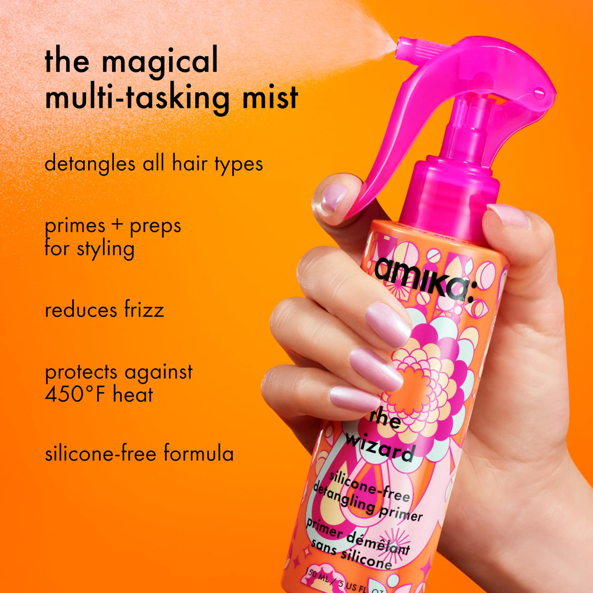 Amika The Wizard nozzle spray closeup demonstrating fine mist and even coverage