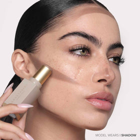 Anastasia Beverly Hills contour stick beside compact mirror for travel-friendly touch-ups