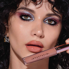 Anastasia Beverly Hills gloss worn on lips displaying fuller-looking shine