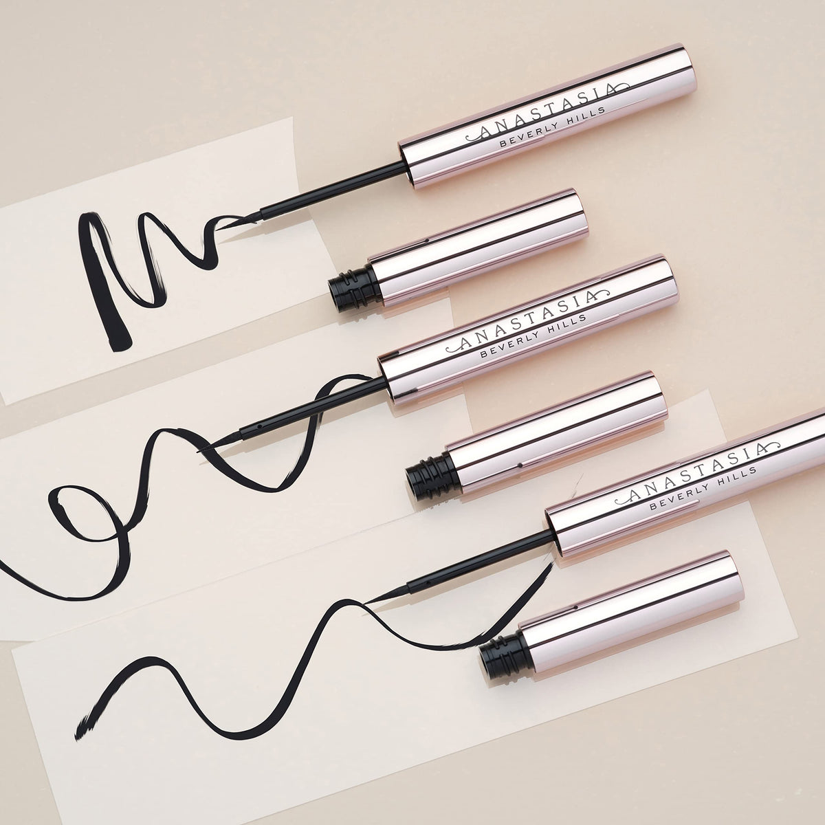 Anastasia Beverly Hills liner beside a coin showing compact size and travel convenience