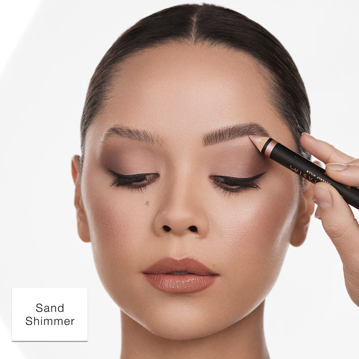 Anastasia Beverly Hills pencil held in hand to show portable size and control