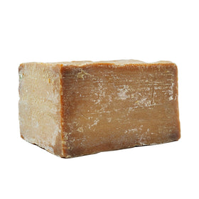 Anatolia Soap lather in hand demonstrating gentle cleansing foam
