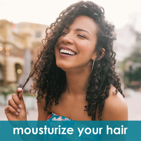 AnatoliaDaphne woman applying conditioner to mid-lengths for detangling and protection
