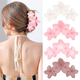 ANBALA front view of four plumeria clips showing colors and shape, stylish accessory