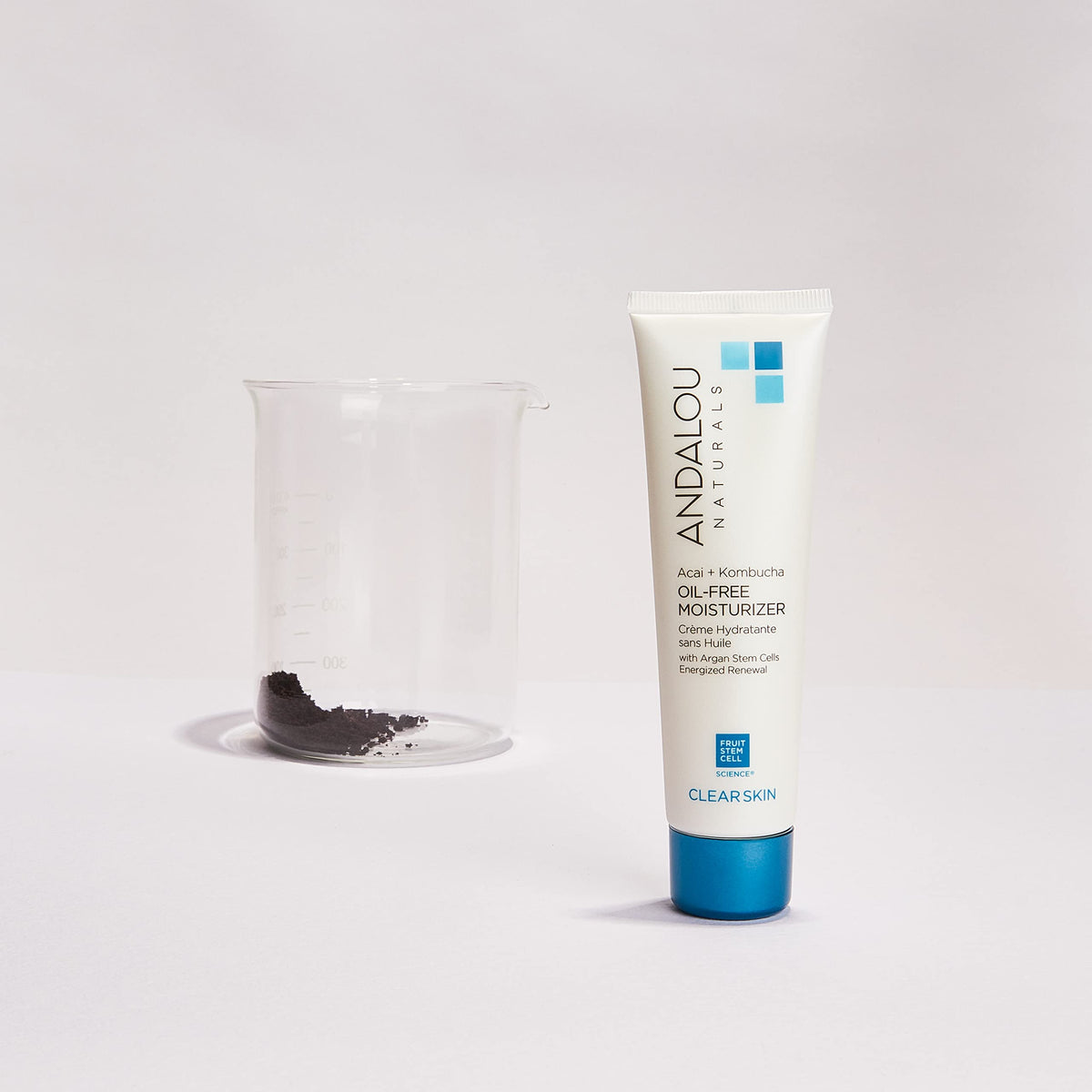 Andalou Naturals moisturizer in hand to show 2.1 fl oz size and travel convenience