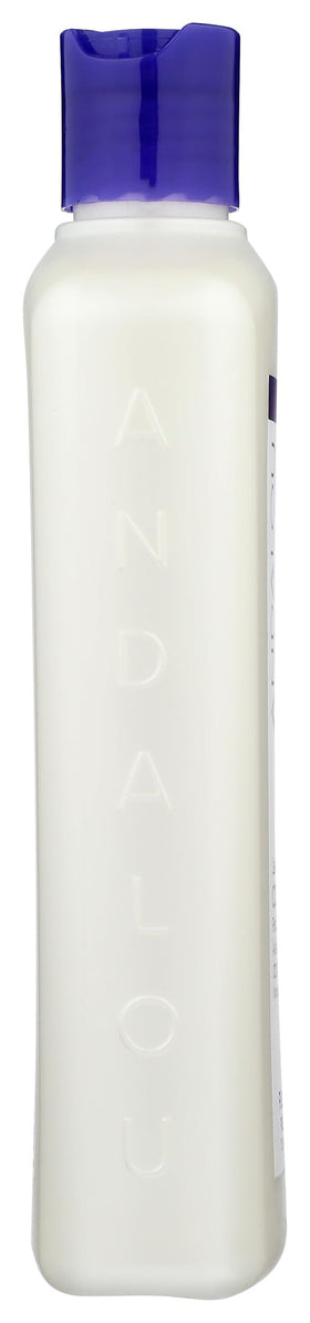 Andalou Naturals 11.5 ounce bottle next to common items for scale and travel-friendly benefit