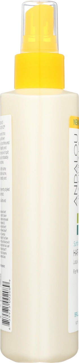 Andalou Naturals bottle held in hand showing 8.2 fl oz size for travel-friendly convenience