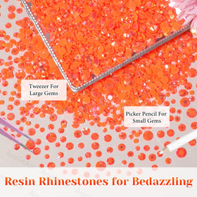 AnoleAir tweezer and pickup pencil arranged with gems for precise placement benefit