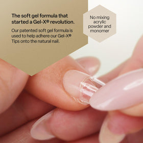 APRÉS technician applying Extend Gel to a Gel-X tip for secure bonding
