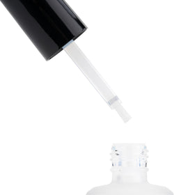 APRÉS pH Bonder being applied to a natural nail to improve adhesion and prevent lifting