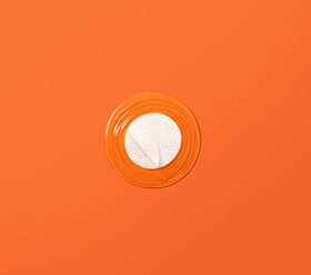 APRILSKIN pads placed in bathroom lifestyle scene showing daily-use benefit