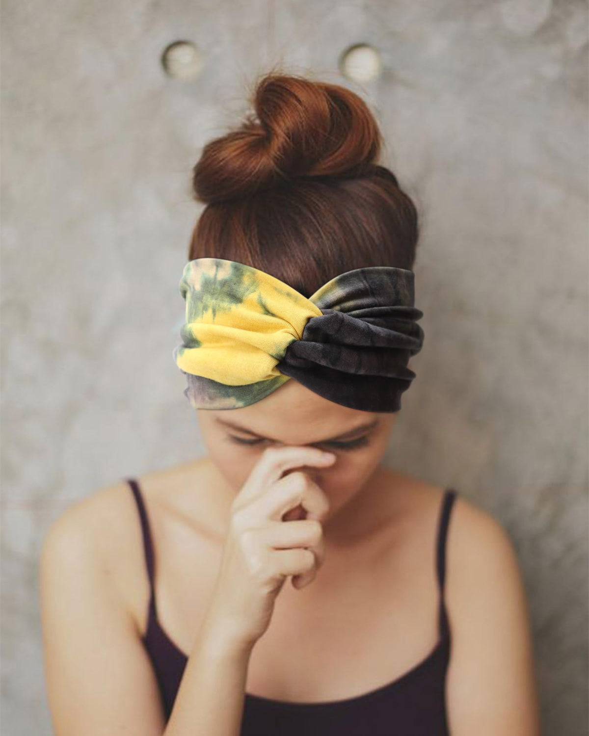 AQOKKA headband in hand showing size and easy travel convenience