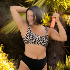 AQUA GUARD being sprayed on wet hair to detangle and soften after swim