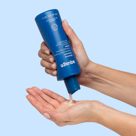 Aquage Silkening Shampoo texture pouring from bottle to show silky consistency