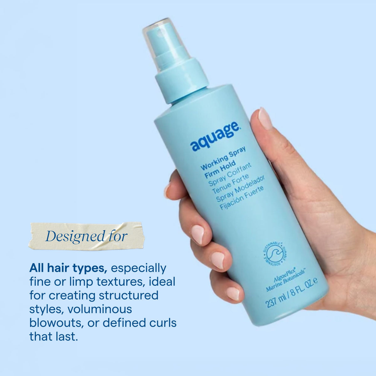 Hand holding Aquage Working Hair Spray for size comparison and portability