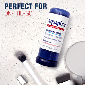 Aquaphor balm stick applied to heel showing barrier protection for cracked skin
