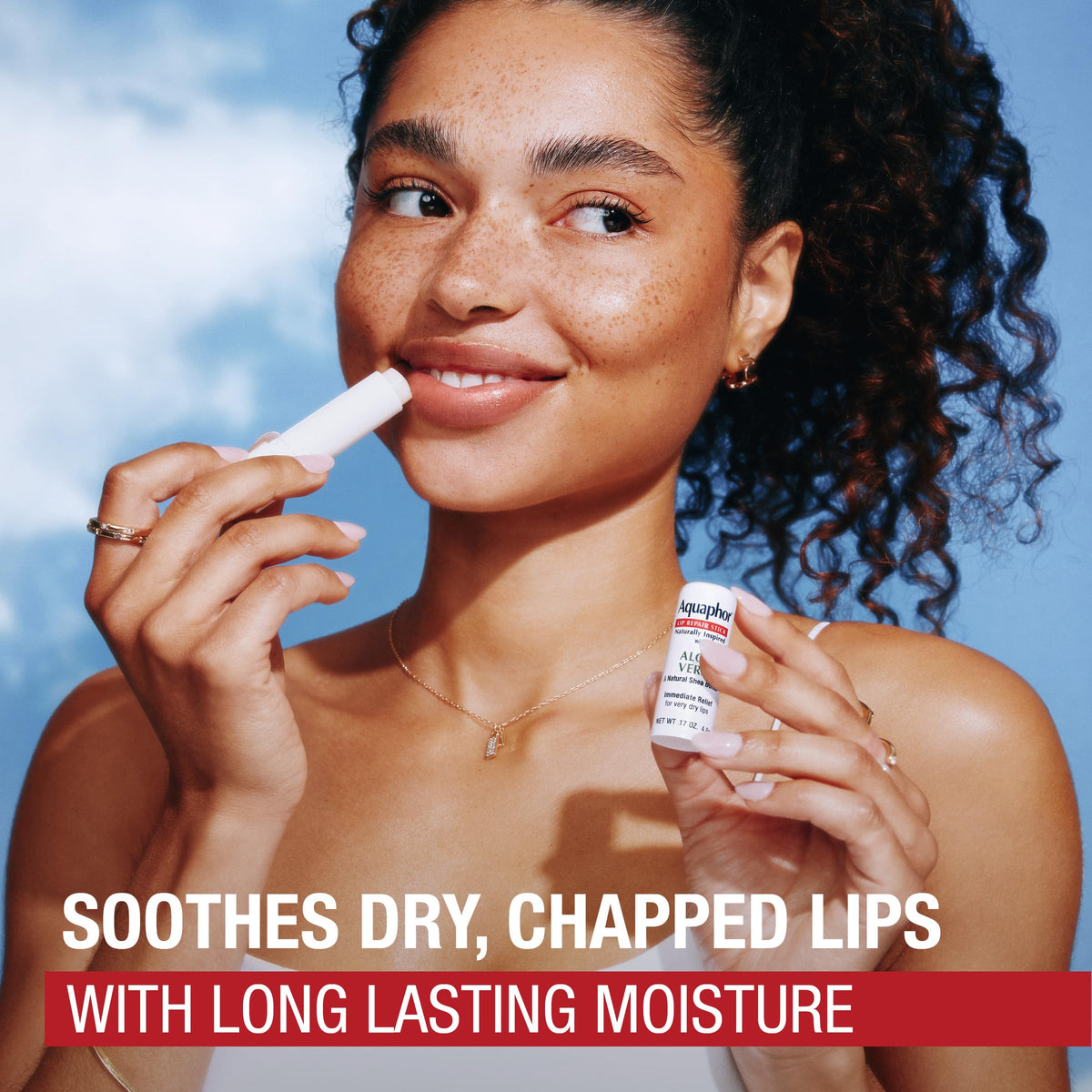Aquaphor stick in hand illustrating size and convenient portability