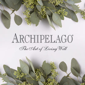 Archipelago Botanicals bottle staged in a bright bathroom for morning ritual