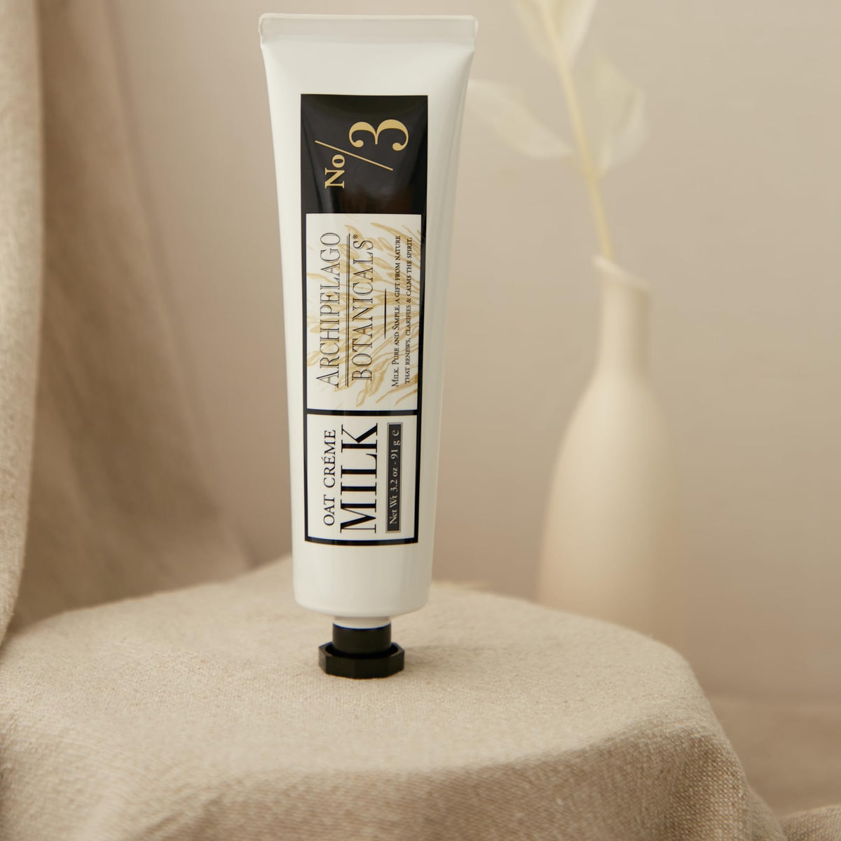archipelago botanicals hand crème being massaged into hands for immediate hydration