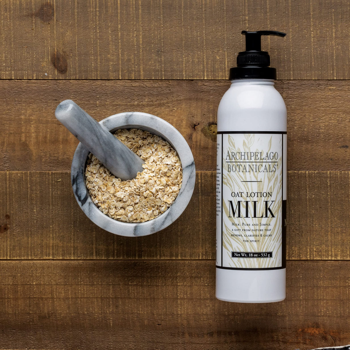 Archipelago Botanicals key ingredients flatlay with oats and white tea highlighting botanical benefits