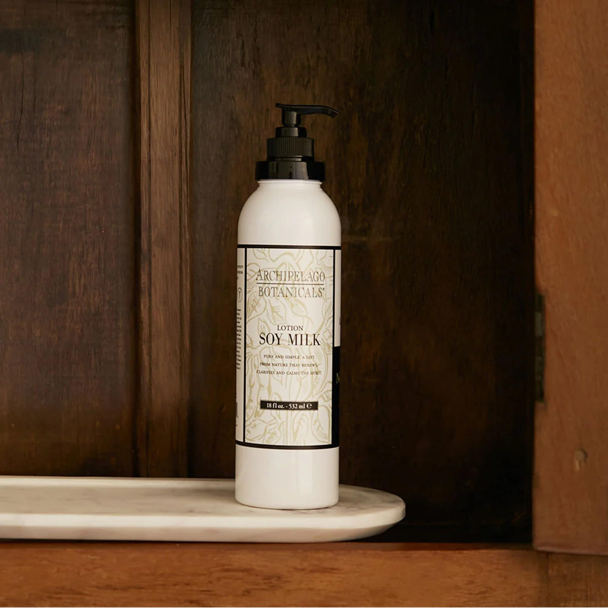 Archipelago Botanicals dispensing lotion from pump demonstrating easy application and convenience