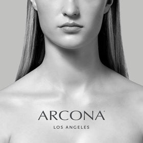ARCONA cranberry gommage styled on bathroom shelf suggesting routine and clarity benefit