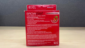 Ardell tint kit next to coin showing compact size ideal for travel