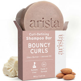 Arista ayurveda front packaging shows travel-friendly shampoo bar and benefits