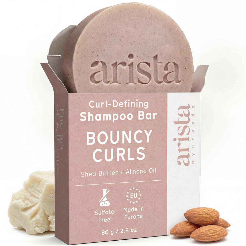 Arista ayurveda front packaging shows travel-friendly shampoo bar and benefits