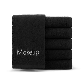 Arkwright front pack black towels showing neat stacked set and durable look