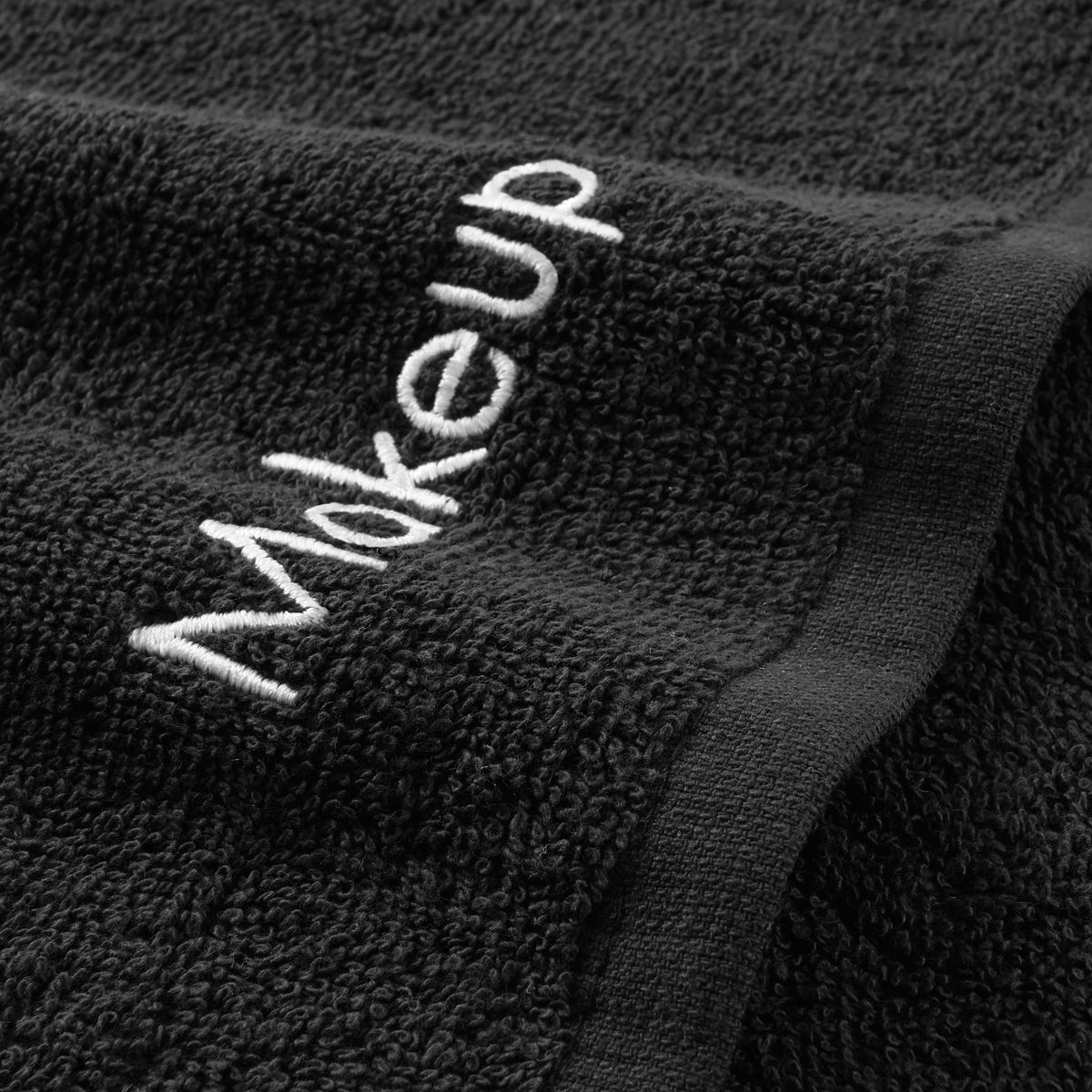 Arkwright folded towel embroidery detail adding stylish bathroom accent