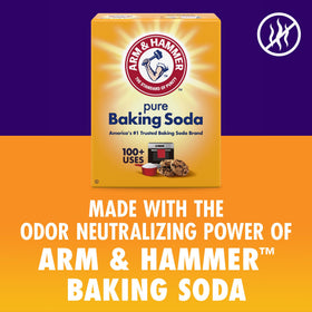 Arm & Hammer 8oz bottle next to hand to show scale and travel-friendly size
