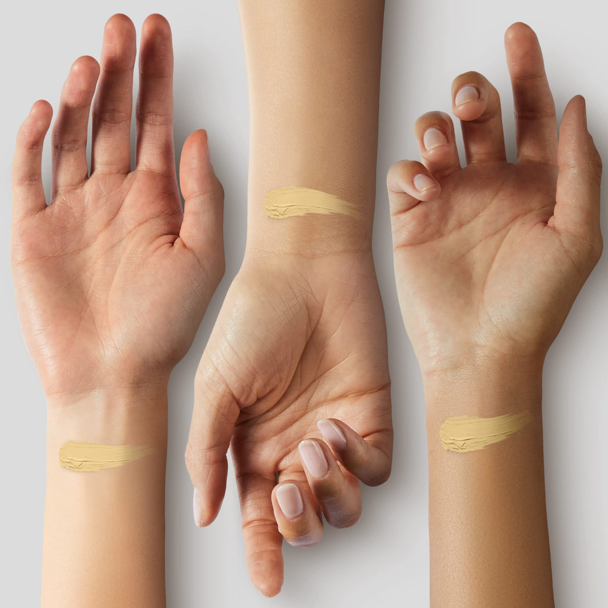 Armani Beauty swatches on forearm comparing shade depth and warm undertone match