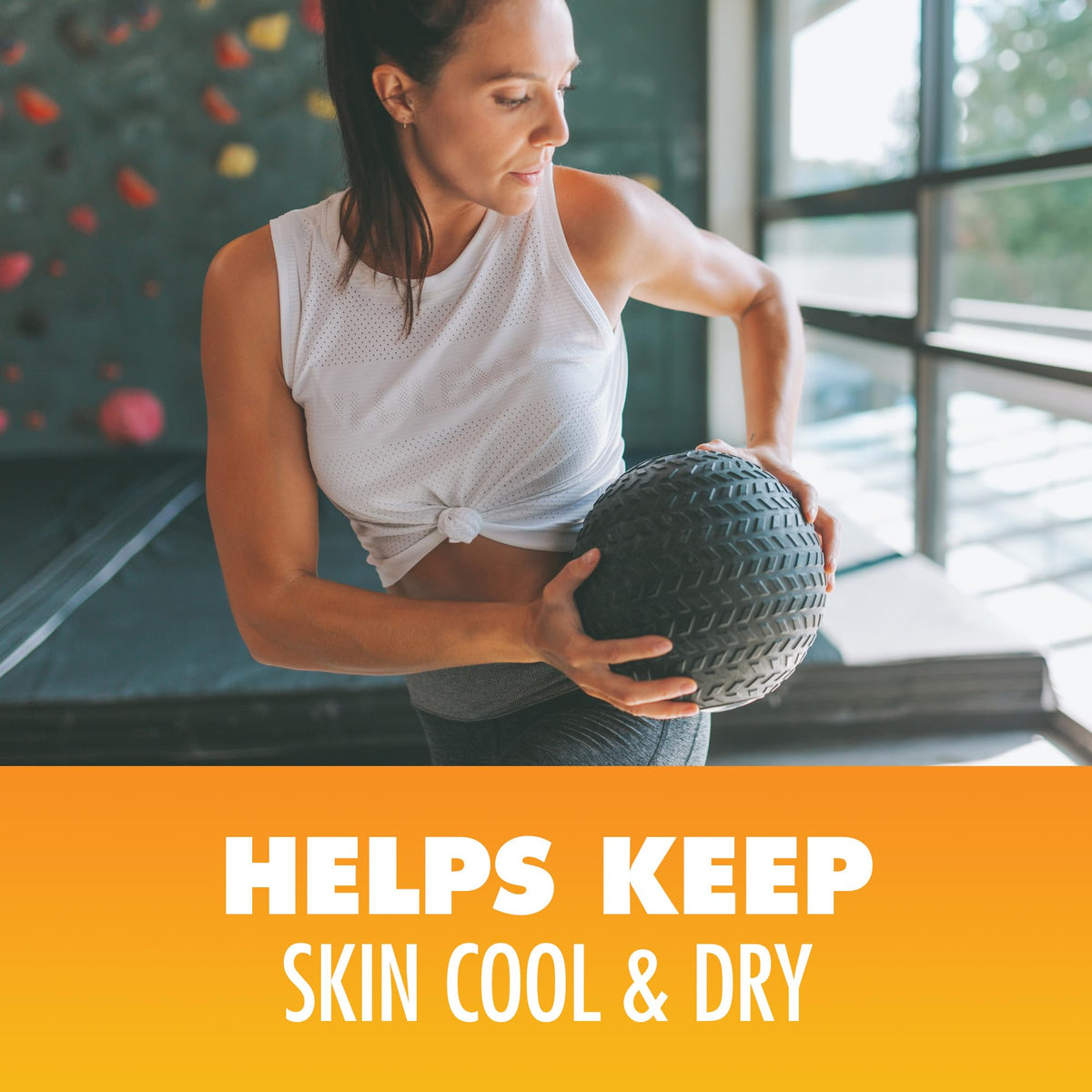 Arm & Hammer body powder being applied underarm demonstrating sweat absorption and odor help