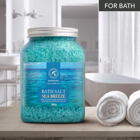 AROMATIKA sea salt dissolving in a bathtub creating relaxing aromatherapy soak
