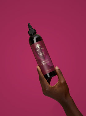 As I Am bottle on bathroom shelf illustrating everyday use and convenience