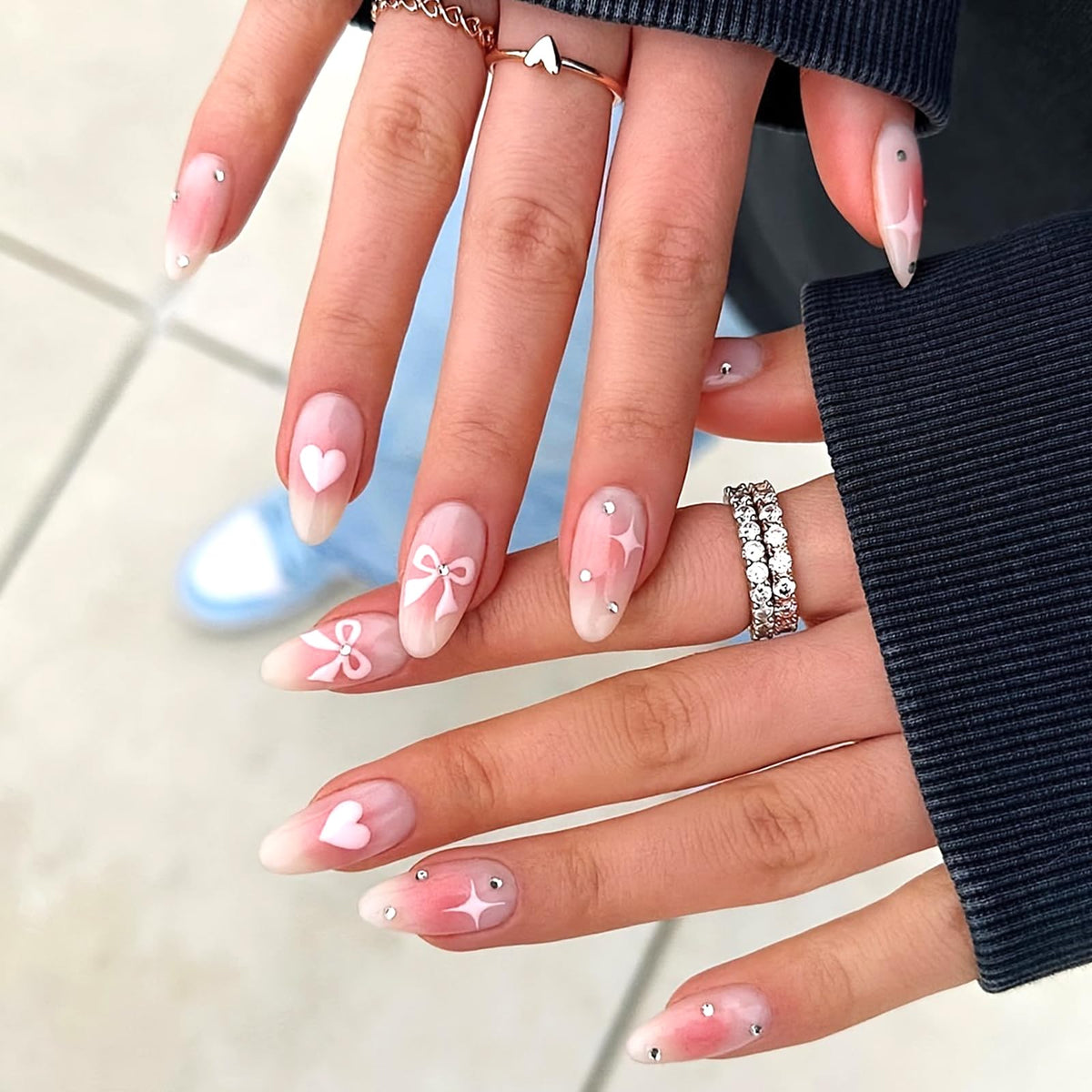 Ashowner hands using adhesive tab for quick application and gentle removal
