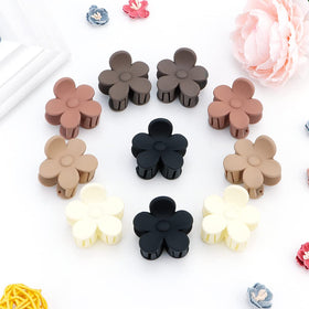 ATODEN clips in a beach outfit setting showing versatile, travel-friendly appeal