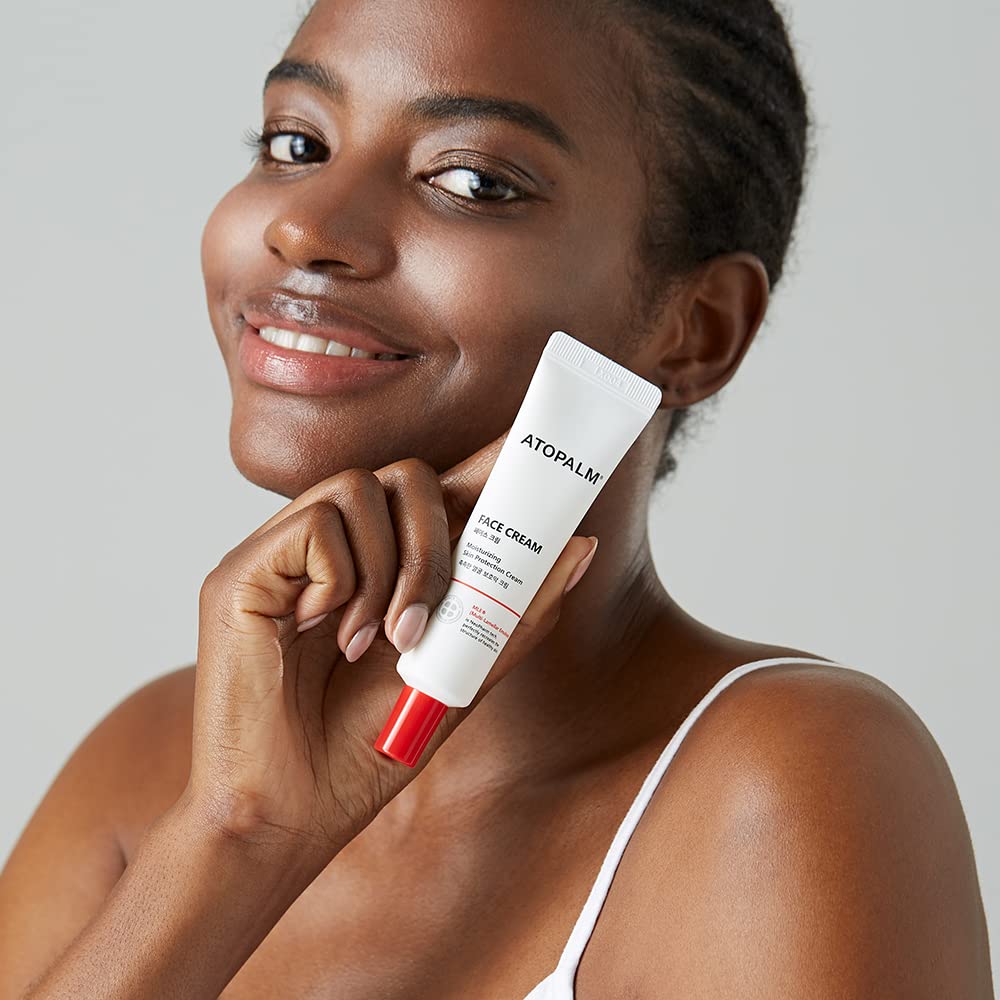 ATOPALM tube with ingredients flatlay showing clean, hypoallergenic benefit