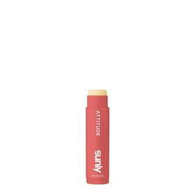 ATTITUDE lip balm on beach towel demonstrating sun protection during outdoor use