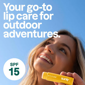 ATTITUDE lip balm being applied outdoors showing on-the-go sun protection