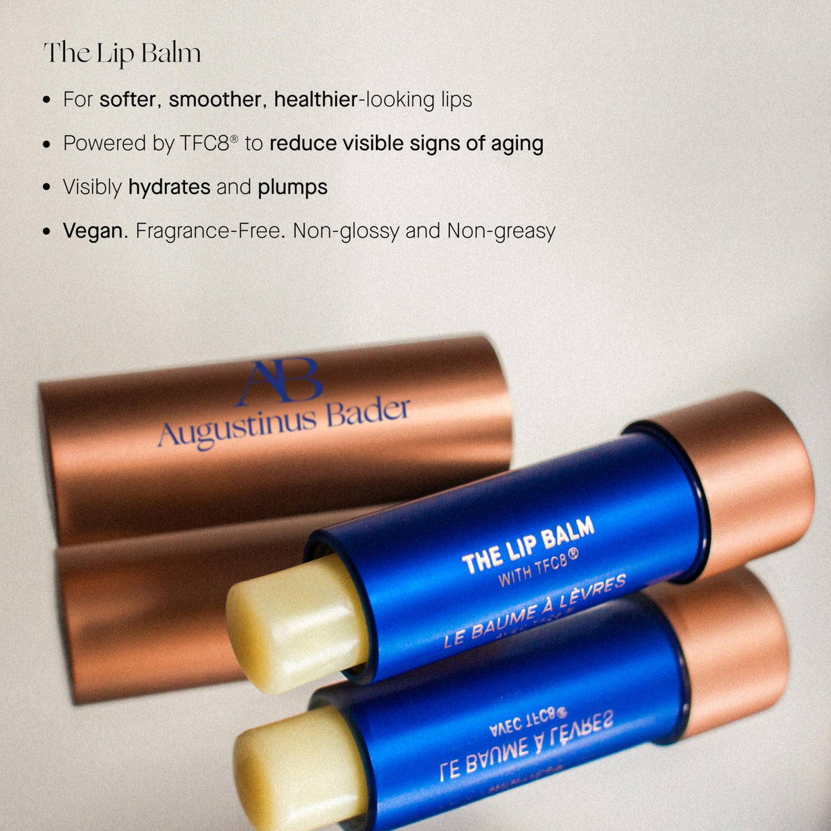 Augustinus Bader lip balm open applying smooth balm for instant comfort