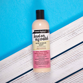 Aunt Jackie's product in palm ready to apply for smoother detangling