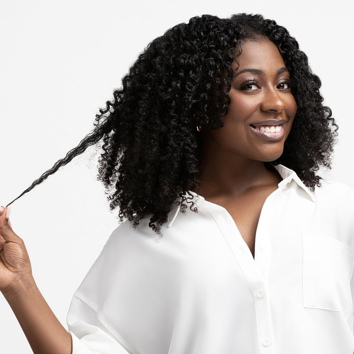 Aunt Jackie's conditioner being applied to wet curls for easier detangling