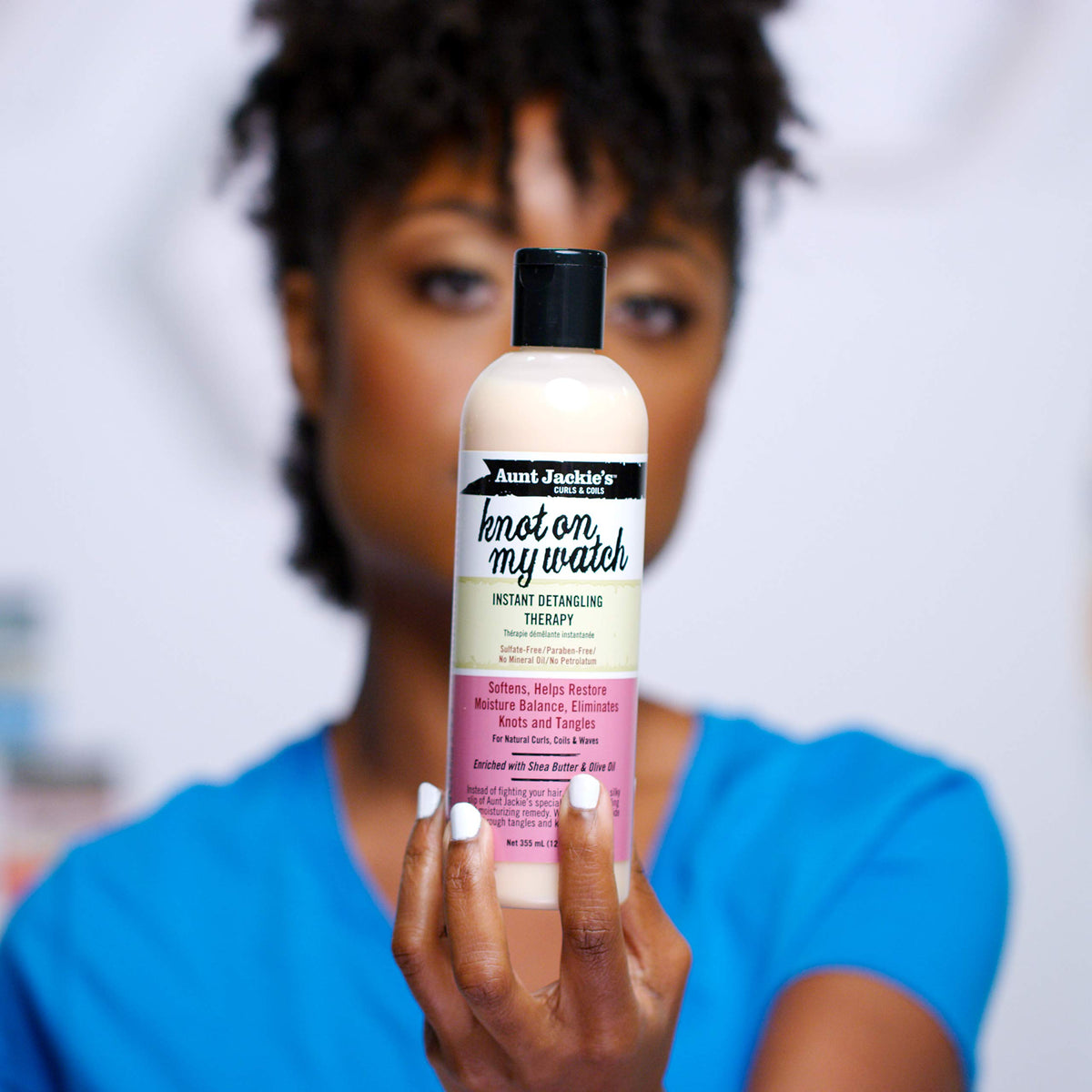 Aunt Jackie's creamy texture swiped on hand showing slip and moisture